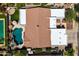 Aerial view of a house showcasing the layout, private backyard with a pool, outdoor kitchen, and surrounding neighborhood at 2105 E San Carlos Pl, Chandler, AZ 85249