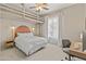 This cozy bedroom has a loft-style bed frame, bright natural light, and a functional desk area, creating a versatile space at 2105 E San Carlos Pl, Chandler, AZ 85249