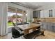 Bright dining area with table and chairs next to kitchen with sliding doors to the backyard at 2105 E San Carlos Pl, Chandler, AZ 85249