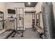 The home gym boasts a treadmill, punching bag, and weightlifting equipment, creating a well-rounded space for fitness enthusiasts at 2105 E San Carlos Pl, Chandler, AZ 85249