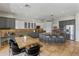 Bright kitchen features two-tone cabinets, an island with bar seating, and stainless steel appliances at 2105 E San Carlos Pl, Chandler, AZ 85249