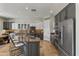 Modern kitchen with granite countertops, stainless steel appliances, and a breakfast bar at 2105 E San Carlos Pl, Chandler, AZ 85249