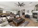 Spacious living room featuring fireplace, comfortable seating and views into kitchen and dinette at 2105 E San Carlos Pl, Chandler, AZ 85249