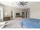 A large primary bedroom is enhanced by neutral colors, soft textures, and natural light, promoting relaxation and comfort at 2105 E San Carlos Pl, Chandler, AZ 85249