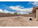 Open backyard with a brick wall, providing privacy and space for outdoor enjoyment at 21610 N Bradford Dr, Maricopa, AZ 85138