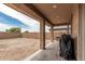 Spacious backyard with a covered patio area, perfect for outdoor living and entertaining at 21610 N Bradford Dr, Maricopa, AZ 85138