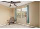 Bedroom featuring chair, and natural light from two windows at 21610 N Bradford Dr, Maricopa, AZ 85138