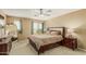 Bedroom with carpet, fan, neutral walls and a large window that provides natural light at 21610 N Bradford Dr, Maricopa, AZ 85138