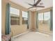 Cozy bedroom that features three large windows for plenty of natural light at 21610 N Bradford Dr, Maricopa, AZ 85138