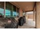 View of the home's covered patio with multiple grilling options at 21610 N Bradford Dr, Maricopa, AZ 85138