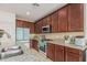 Spacious kitchen showcasing wood cabinets, granite counters, and stainless steel appliances at 21610 N Bradford Dr, Maricopa, AZ 85138