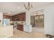 Spacious kitchen boasts cherry cabinets, granite countertops, and modern stainless appliances at 21610 N Bradford Dr, Maricopa, AZ 85138