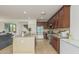 Well-appointed kitchen with granite countertops, stainless appliances, and warm wood cabinets at 21610 N Bradford Dr, Maricopa, AZ 85138