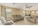 Upstairs living room area with multiple seating options and natural light at 21610 N Bradford Dr, Maricopa, AZ 85138