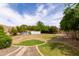 Expansive backyard with a pool, mature trees, and an area for recreation offering a private outdoor retreat at 2203 E Tonto Pl, Chandler, AZ 85249