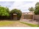 Backyard featuring a swing set, climbing net and an arbor inviting outdoor play and Gathering fun at 2203 E Tonto Pl, Chandler, AZ 85249