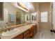 Bathroom featuring double sinks with vanity, large mirror and great lighting at 2203 E Tonto Pl, Chandler, AZ 85249