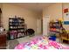 Bedroom featuring playful art, large dresser and comfortable seating at 2203 E Tonto Pl, Chandler, AZ 85249