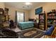 Comfortable bedroom featuring ceiling fan, lots of storage, and a bright window at 2203 E Tonto Pl, Chandler, AZ 85249