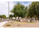 Welcoming entrance to Cooper Country community, featuring attractive monument signage and desert landscaping at 2203 E Tonto Pl, Chandler, AZ 85249