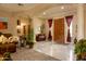 Spacious entryway with marble floors, a custom wood door, and elegant architectural details at 2203 E Tonto Pl, Chandler, AZ 85249