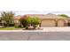 Lovely single-Gathering home featuring a spacious three-car garage and attractive desert landscaping at 2203 E Tonto Pl, Chandler, AZ 85249