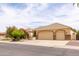Well-maintained home showcasing a three-car garage, desert landscaping, and inviting curb appeal at 2203 E Tonto Pl, Chandler, AZ 85249