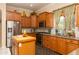 Charming kitchen featuring stainless appliances, stone countertops, and light wood cabinets at 2203 E Tonto Pl, Chandler, AZ 85249