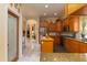 Well-appointed kitchen featuring a pantry, light wood cabinets, and stainless steel appliances at 2203 E Tonto Pl, Chandler, AZ 85249