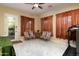 A flexible bonus room featuring outdoor access and ample natural light from multiple windows at 2203 E Tonto Pl, Chandler, AZ 85249