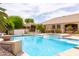 Beautiful backyard featuring a refreshing pool, spa, and well-maintained landscaping for relaxing and entertaining at 2203 E Tonto Pl, Chandler, AZ 85249