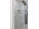 Walk-in shower featuring a marble surround, wall niche, and sleek fixtures at 2203 E Tonto Pl, Chandler, AZ 85249