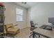 Bedroom with a comfortable work-from-home setup and plenty of natural light at 22463 E Desert Spoon Dr, Queen Creek, AZ 85142
