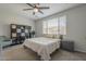 A bedroom with carpet, a ceiling fan, a window with blinds, and a cubby shelf at 22463 E Desert Spoon Dr, Queen Creek, AZ 85142