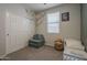 A bedroom featuring a small bed, closet, and playful decor at 22463 E Desert Spoon Dr, Queen Creek, AZ 85142