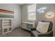 Bright bedroom featuring fun wall decor and comfortable seating at 22463 E Desert Spoon Dr, Queen Creek, AZ 85142