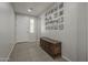 Bright entryway with tile flooring, and a decorative wall and furniture at 22463 E Desert Spoon Dr, Queen Creek, AZ 85142
