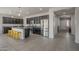 Modern kitchen with stainless steel appliances, an island with seating, and dark cabinetry at 22463 E Desert Spoon Dr, Queen Creek, AZ 85142