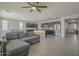 Open-concept kitchen with granite countertops, stainless steel appliances, and a large island with seating at 22463 E Desert Spoon Dr, Queen Creek, AZ 85142