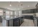 Open kitchen with a view of the dining area and sliding glass door, featuring a functional layout at 22463 E Desert Spoon Dr, Queen Creek, AZ 85142