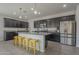 Well-appointed kitchen with stainless steel appliances, granite countertops, and ample cabinet space at 22463 E Desert Spoon Dr, Queen Creek, AZ 85142