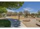 A community playground with a slide and swings, perfect for , offers a blend of fun and outdoor activity at 22463 E Desert Spoon Dr, Queen Creek, AZ 85142