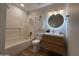 This bathroom features an updated vanity and tub with shower at 2337 E Manhatton Dr, Tempe, AZ 85282