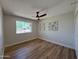 This bedroom features a ceiling fan and a window at 2337 E Manhatton Dr, Tempe, AZ 85282