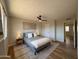 This bedroom features a ceiling fan and neutral decor at 2337 E Manhatton Dr, Tempe, AZ 85282