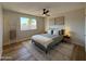 Serene bedroom featuring a comfortable bed, neutral decor, and ample natural light, creating a peaceful and relaxing retreat at 2337 E Manhatton Dr, Tempe, AZ 85282