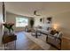 Well-lit living room with elegant decor, comfortable seating, and a view of the neighborhood, creating a cozy atmosphere at 2337 E Manhatton Dr, Tempe, AZ 85282