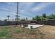 Spacious backyard featuring a seating area and a trampoline with palm tree views at 2345 N 28Th Pl, Phoenix, AZ 85008