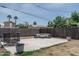 Backyard featuring a patio with seating, trampoline and large potted plants at 2345 N 28Th Pl, Phoenix, AZ 85008