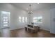 Bright dining area with modern lighting and a view of the front yard at 2345 N 28Th Pl, Phoenix, AZ 85008